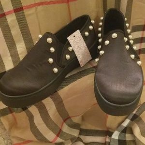 Pair of Love University slip-on shoes